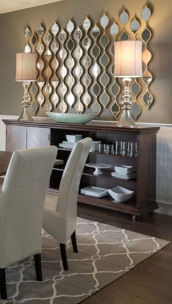 32 Mirror Decorating Ideas - Transform Home With Mirrors 31 Decorative mirrors arranged on a wall in warm earth tones, enhancing a stylish dining room with elegant design elements.