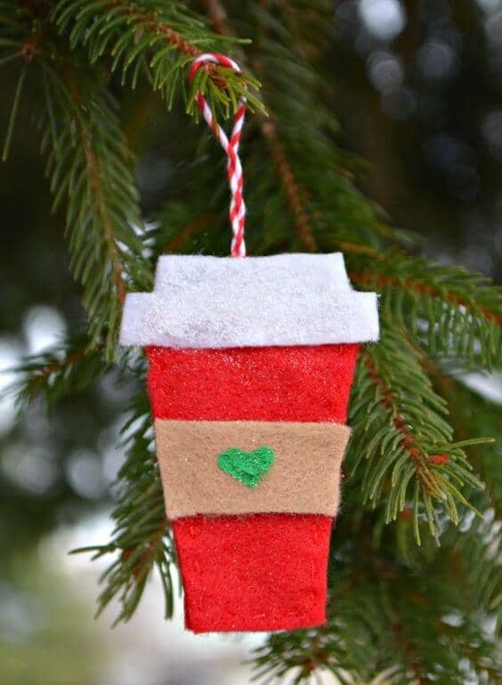 37 DIY Christmas Ornament Ideas For You Unique Decor 13 Felt coffee cup ornament features a vibrant red base, gray lid, and brown sleeve with a green heart, perfect for holiday decor.