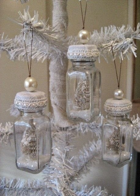 37 DIY Christmas Ornament Ideas For You Unique Decor 25 Trio of glass jars on a white Christmas tree, filled with miniature white trees and faux snow, adorned with lace and pearls.