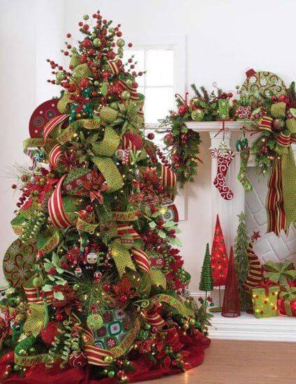Abundant Christmas ornaments in vibrant reds and greens adorn a 6 to 7-foot tree, enhancing a warm holiday atmosphere.