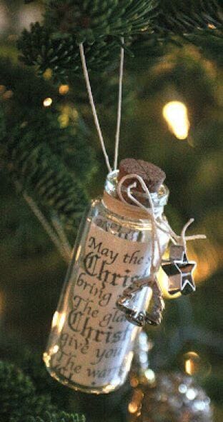 37 DIY Christmas Ornament Ideas For You Unique Decor 4 Small glass bottle ornament hangs from a pine branch, containing a rolled greeting. Decorated with twine and a silver star charm.