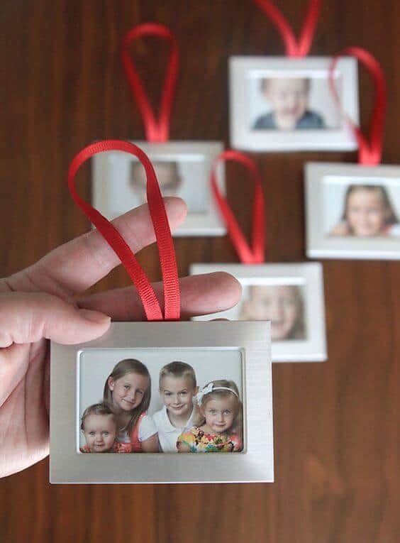 37 DIY Christmas Ornament Ideas For You Unique Decor 33 Sleek brushed silver decorative photo frame with a red ribbon, perfect for DIY Christmas ornaments and festive displays.