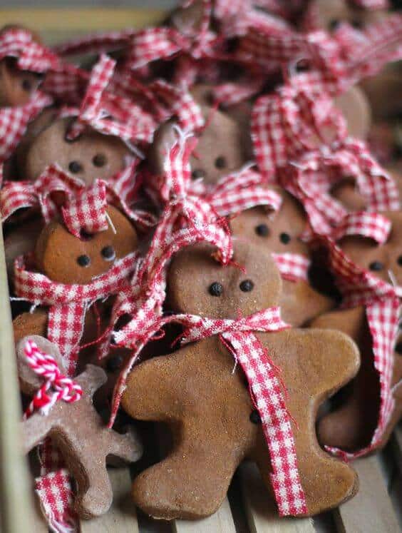 37 DIY Christmas Ornament Ideas For You Unique Decor 38 Gingerbread man cookies, 4 inches tall, with red-and-white gingham ribbons and dark chocolate bead eyes, perfect for festive displays.