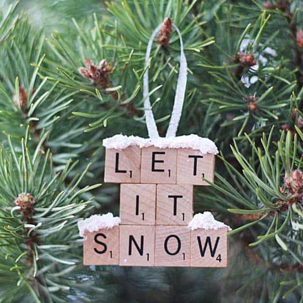 37 DIY Christmas Ornament Ideas For You Unique Decor 9 Handmade wooden ornament with 'LET IT SNOW' on rustic blocks, topped with snowy white, perfect for DIY Christmas decorations.