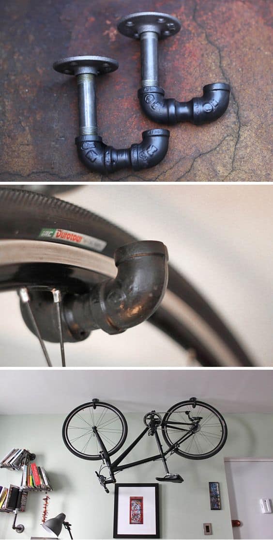 Bicycle suspended by plumbing pipes on a light wall, with shelving nearby, showcasing innovative garage organization ideas.