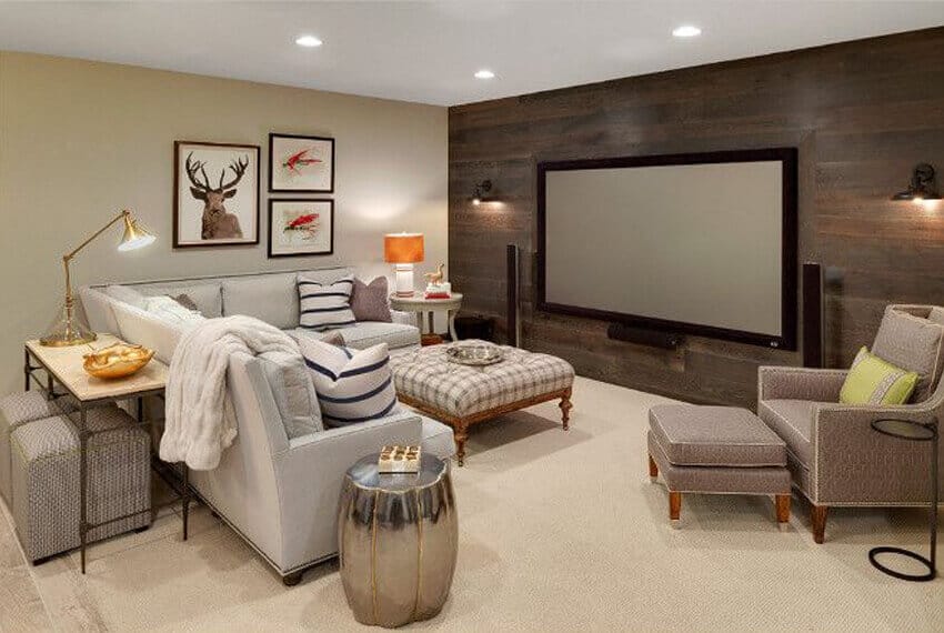 Cozy basement playroom featuring a light gray sectional sofa, wall-mounted TV, and stylish decor, perfect for kids' relaxation and entertainment.