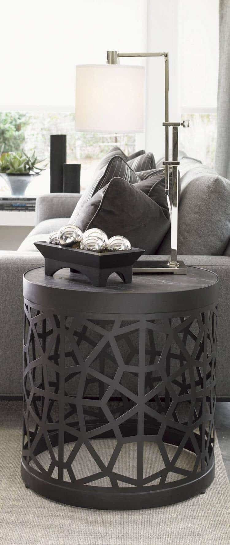 27 Contemporary Living Room Ideas for a Modern Haven Space 7 Contemporary side table with geometric cutouts, matte black finish, ideal for modern living room decor. Functional and stylish design.