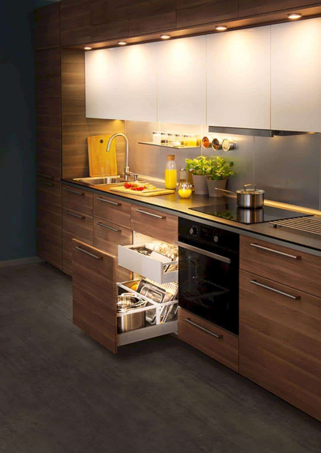 Modern kitchen featuring sleek wooden cabinetry, concrete countertops, and efficient storage solutions, including pull-out drawers and under-cabinet shelves.