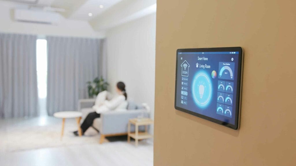 Photo of a smart home tablet hang on the wall to control the home.
